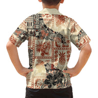 Beige Hawaiian shirt back view with orange, black tribal and floral patchwork