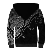 Black unisex sherpa hoodie, back view, white tribal print on hood and sleeves