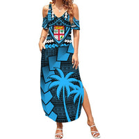 Women’s blue off-shoulder maxi dress with bold geometric tribal print and chest crest