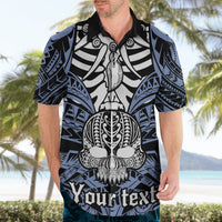 Blue Hawaiian shirt on model with front button-up collar and skull boar tusk print