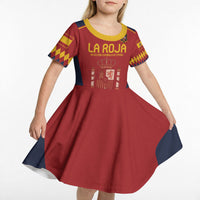 Kids red short-sleeve soccer dress with yellow trim, navy side panels, La Roja crest graphic