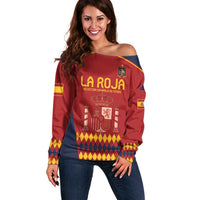 Red off-shoulder sweater with LA ROJA crest logo and multicolor diamond pattern hem
