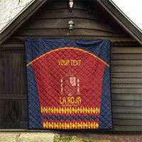 Navy blue Spain football quilt hung on wall, red center crest and gold text
