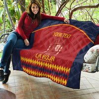 Lounge quilt draped outdoors: navy blue frame, red center, crest and yellow diamond hem