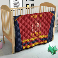 Navy blue baby quilt with red Spain crest and yellow diamond pattern at bottom