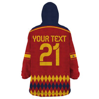 Red and navy Spain blanket hoodie with hood, 'YOUR TEXT 21' back graphic and argyle hem