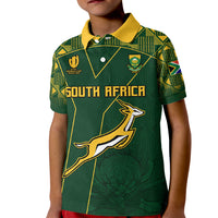 Kids green rugby polo shirt with yellow collar and South Africa front graphic