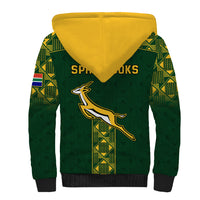 Green sherpa hoodie back with yellow-lined hood and large kangaroo emblem
