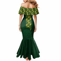 Green off-shoulder fitted mermaid dress with geometric pattern and flared bottom