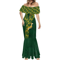 Green off-shoulder mermaid dress with geometric yoke and scalloped flared hem