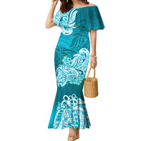 Aqua off-shoulder mermaid maxi dress with teal floral tribal print and ruffled sleeves