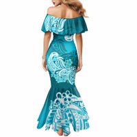 Teal aqua off-shoulder mermaid dress with bold white tribal floral print, back view