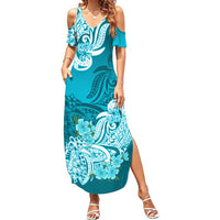 Aqua cold-shoulder maxi dress with bold floral and tribal print, side slit