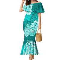 Women’s turquoise mermaid dress with off-shoulder ruffle and white floral tribal print