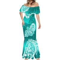 Women’s turquoise mermaid dress with off-shoulder ruffle and white tribal flower pattern