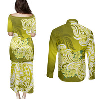 Green pulletasi dress and long-sleeve button shirt, back view with floral tribal print