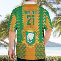 Back of orange-and-green Hawaiian football shirt with "YOUR TEXT 21" and elephant badge