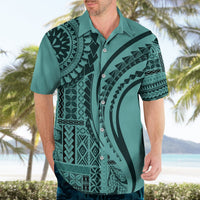 Turquoise Hawaiian shirt on adult, black tribal print, short sleeves, button front
