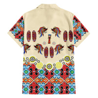 Beige button-up short-sleeve Hawaiian shirt, back view with bird-and-shield motif