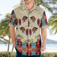 Beige button-up short-sleeve Hawaiian shirt on model, front bird-and-shield motif