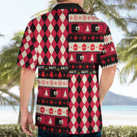 Red, black, and white plaid Hawaiian shirt back with decorative rows of Haiti symbols, short sleeves