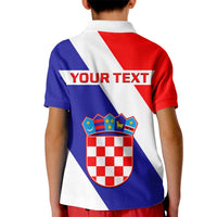 Kids back polo shirt with red, white and blue panels and large shield crest