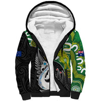 Sherpa hoodie with black zip, white fleece hood lining, green/black tribal print