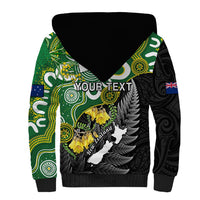 Sherpa hoodie with black hood, green tribal sleeves, front graphic with yellow flowers