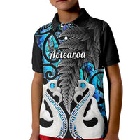 Kids polo shirt with black collar and blue/white patterned front featuring Aotearoa