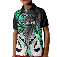 Kids black polo shirt with green fern and fish graphic front