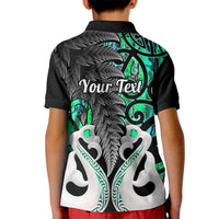 Kids black polo shirt with green fern and fish graphic on back