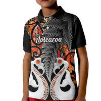 Kids black polo shirt with whale graphic, Maori motifs, and buttoned collar