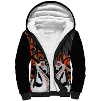 Black sherpa hoodie with white-lined hood and front Maori fish and fern graphic