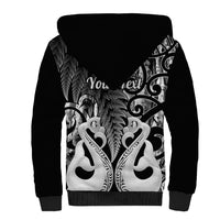 Black sherpa zip-up hoodie with large back Maori-style feather graphic