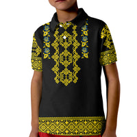 Kids black polo shirt with yellow-green Ukrainian-style folk pattern on front and sleeves