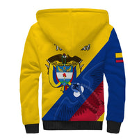 Yellow sherpa hoodie with blue side stripe and crest graphic on back, black rib cuffs