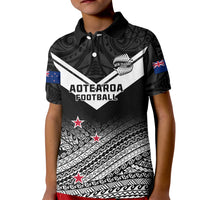 Kid black polo shirt with white Maori fern tribal print and red star accents
