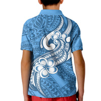 Kids blue polo shirt, back view, white floral and tribal pattern, short sleeves