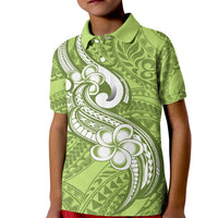 Kids green polo shirt with white plumeria and tribal pattern, short sleeves
