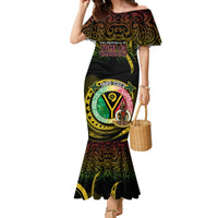 Black off-shoulder mermaid-style dress with colorful circular graphic print