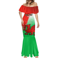 Off-shoulder mermaid dress in red and green with dragon graphic and flared hem