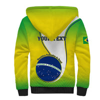 Unisex sherpa-lined hoodie, green and yellow hood with Brazil shield graphic on back