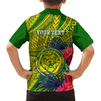 Green back of Hawaiian shirt with 'YOUR TEXT', lion crest, tropical flowers and geometric pattern