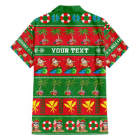 Green and red Hawaiian Christmas button-up shirt with palm, candy, and penguin prints