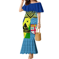 Blue off-shoulder mermaid maxi dress with ruffled neckline and colorful Polynesian print panel