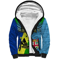 Blue sherpa zip hoodie with black trim, green-yellow tribal emblem panels and white-lined hood
