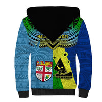 Blue sherpa hoodie, black hood lining, back graphic with tribal patterns and 'MAL... DAY' text