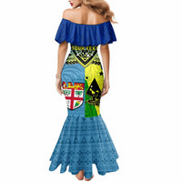 Blue off-shoulder mermaid maxi dress, allover Polynesian print and ruffle neckline