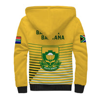 Yellow zip-up sherpa hoodie with green striped panel and South Africa crest
