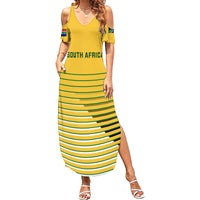Women's yellow off-shoulder maxi dress with green striped skirt and South Africa sleeve patches